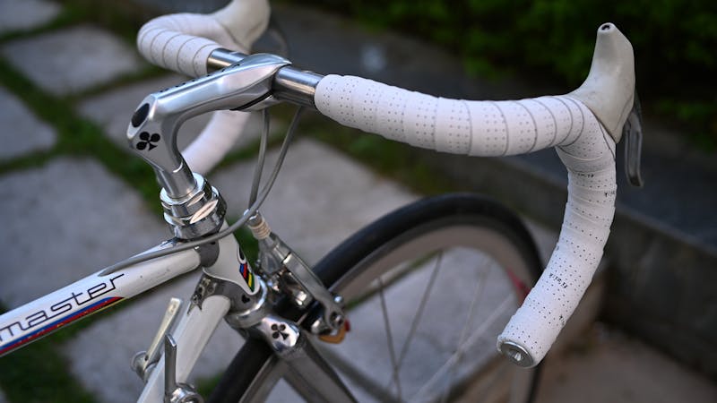 Road cyclists demonstrating bike handling on a scenic route