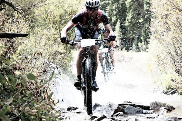 Gravel cyclist riding on a forest fire road